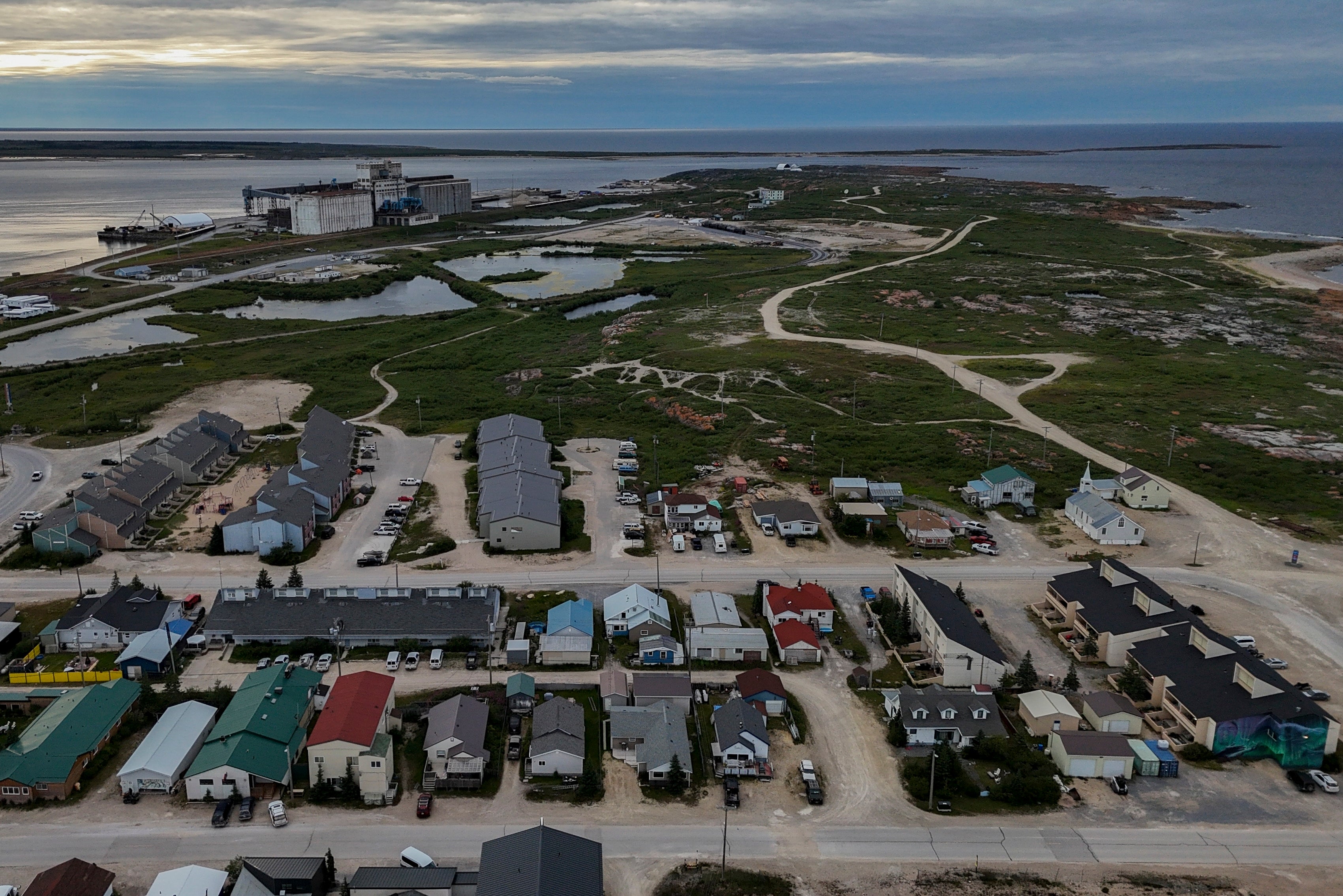 A grain port, top left, stands on the outskirts of town, Wednesday, Aug. 7, 2024, in Churchill,