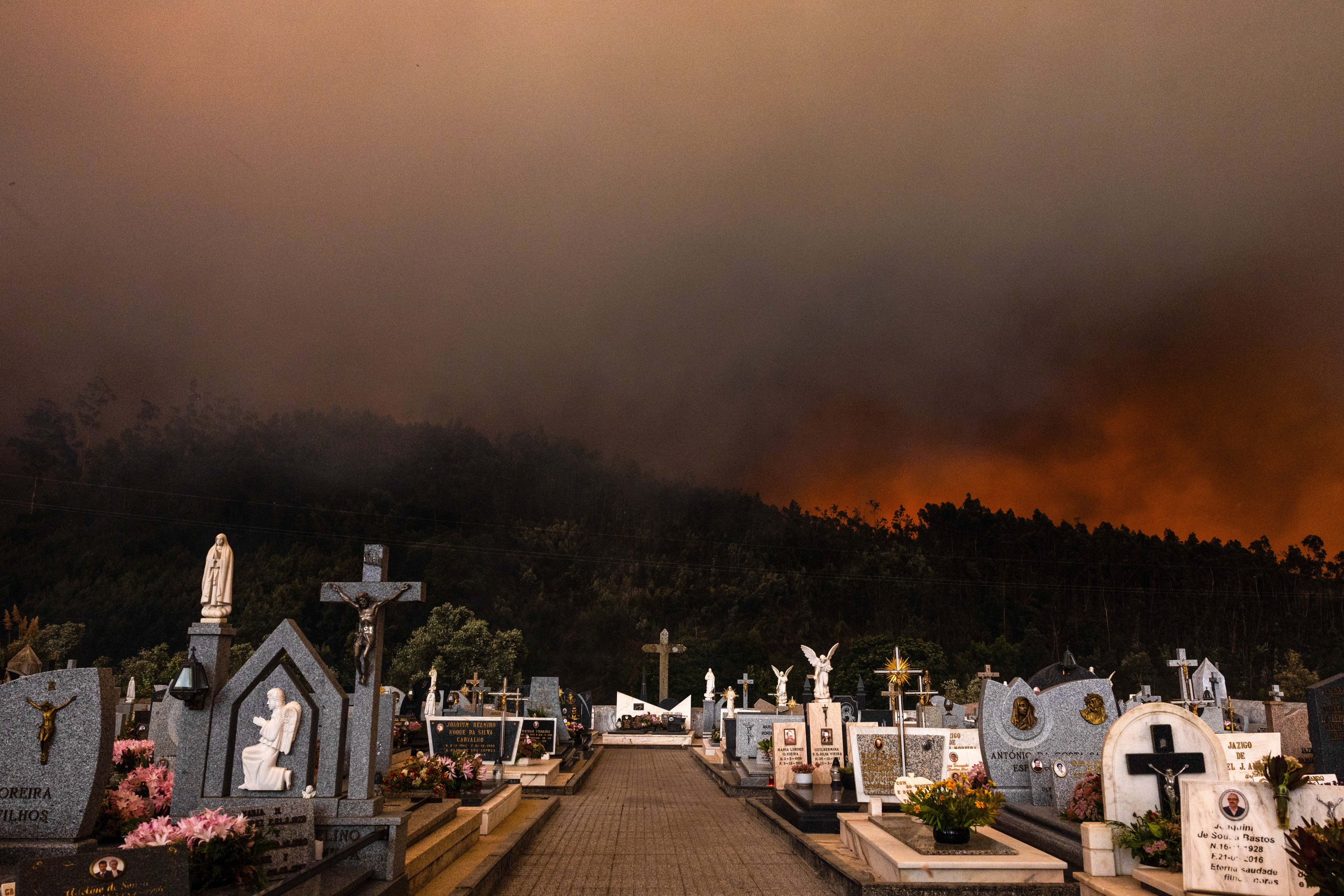 Covelo cemitery flanked by the forrest fire in Covelo, Gondomar, northern Portugal