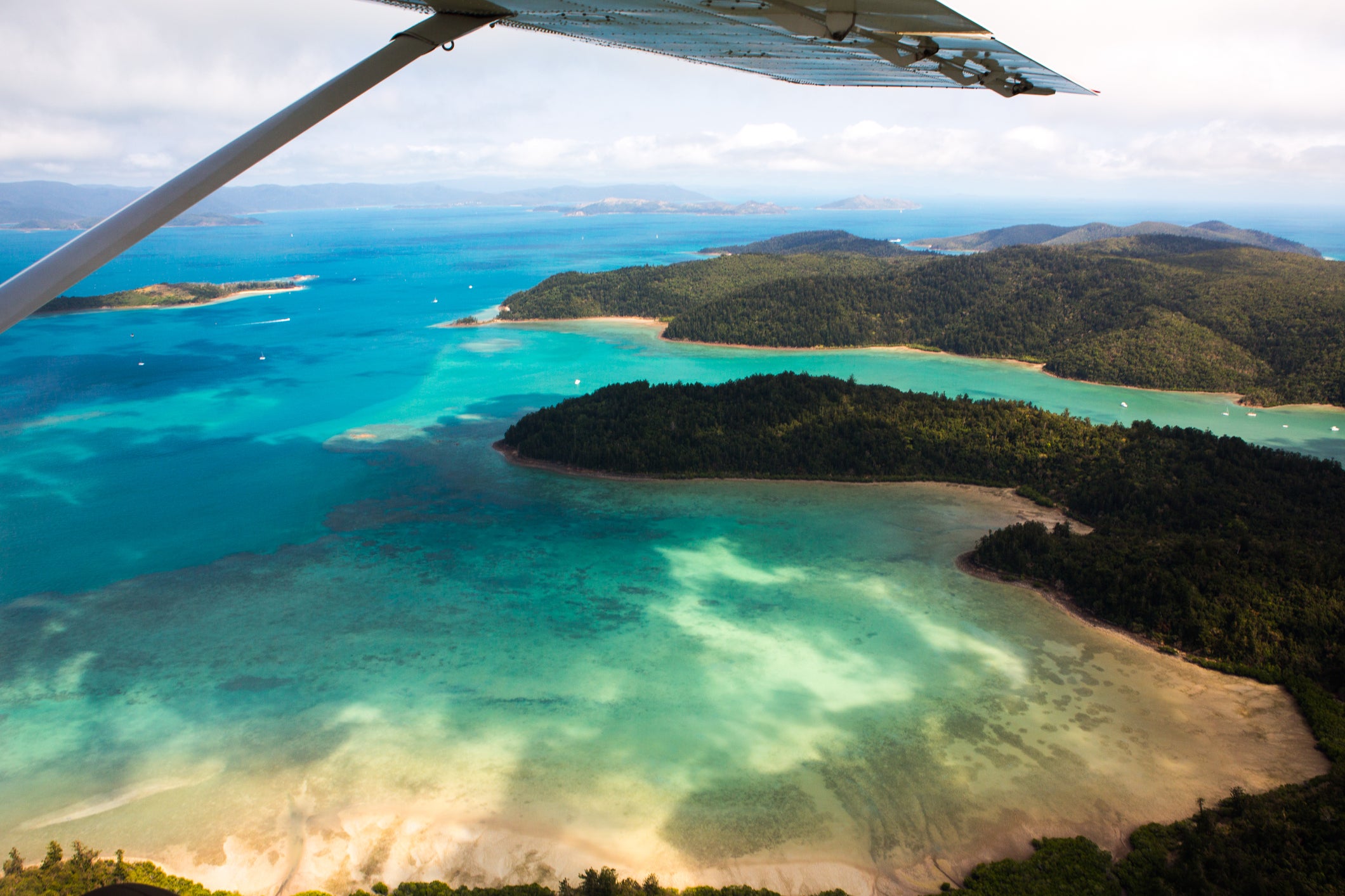 Freefall from 15,000ft above sea level on a tandem ride over Airlie Beach’s marine playground