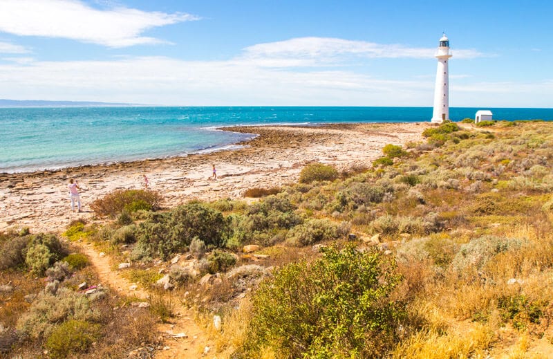 lighthouse next to the ocean