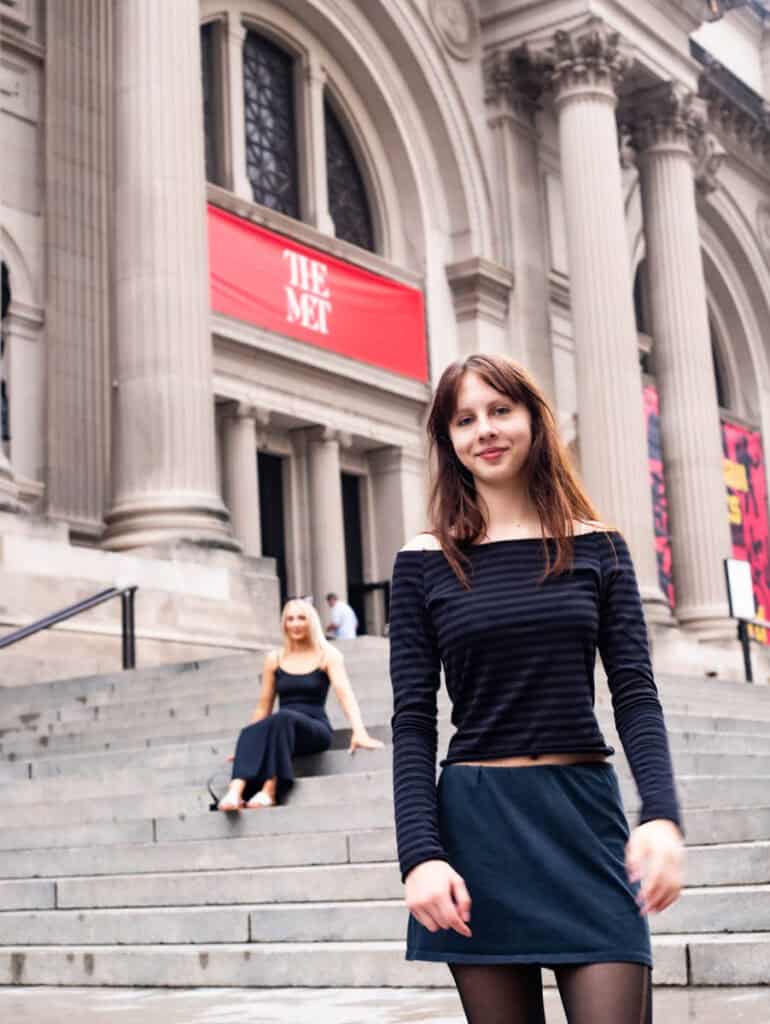 girl standing on Met steps