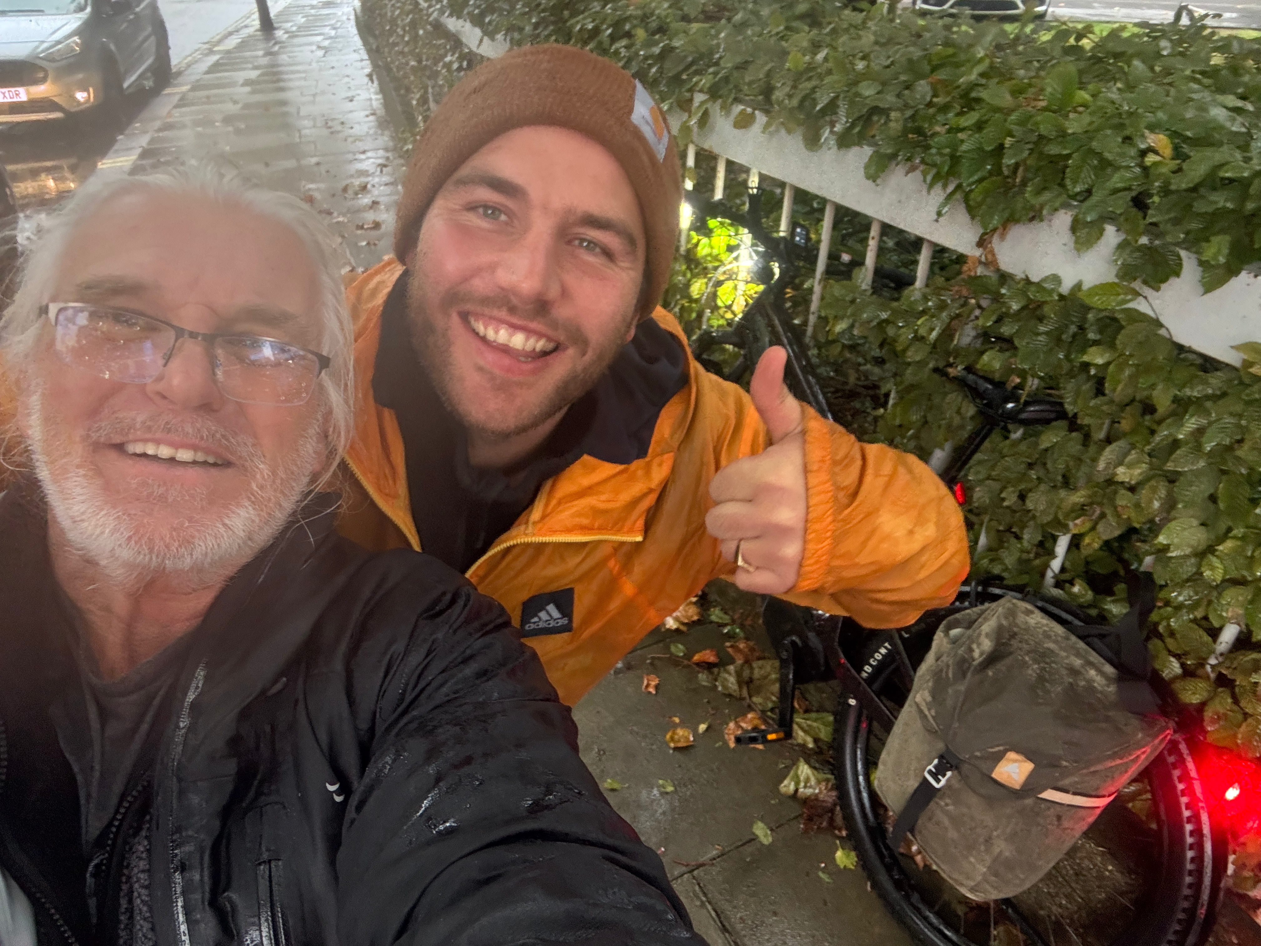 Barney Davis and Mark Vinall are pictured smiling together after fending off a would-be bike thief