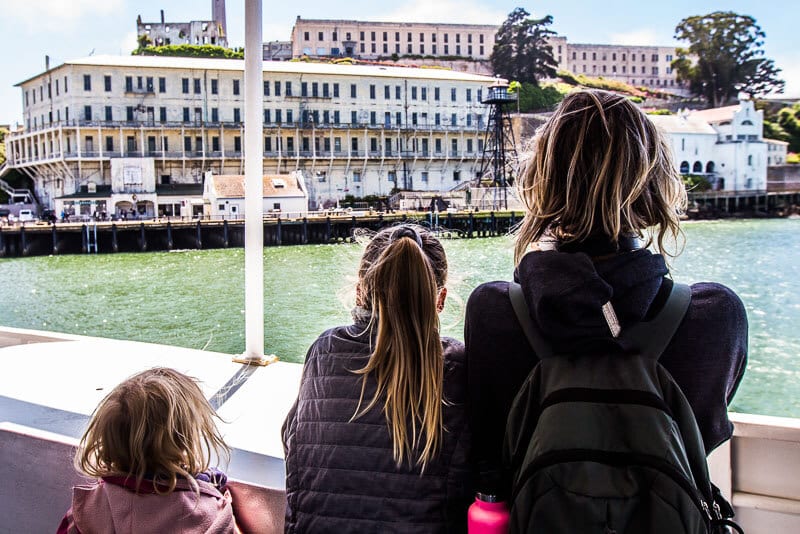 family looking at Alcatraz Island  from the ferry