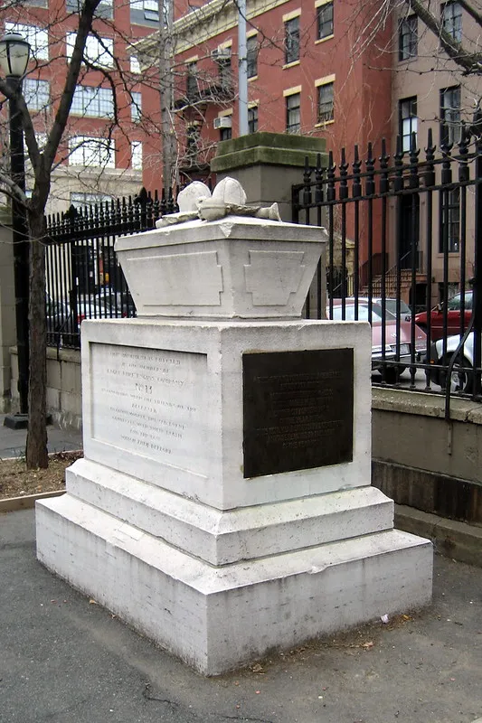 monument at northern entrance of James J. Walker Park