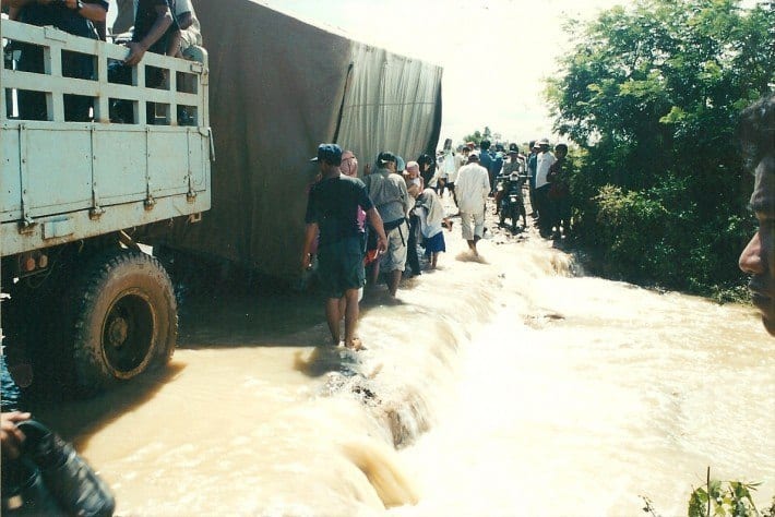 trucks overturned on flooded road in cambodia