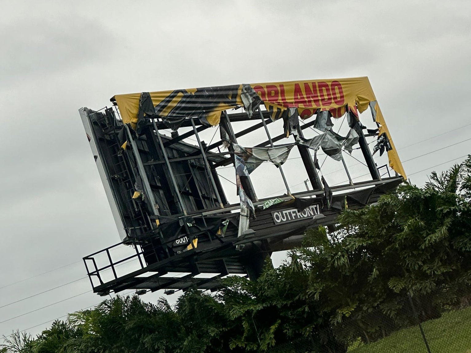 Mr Sly took a picture of a torn up billboard following the devastating hurricane