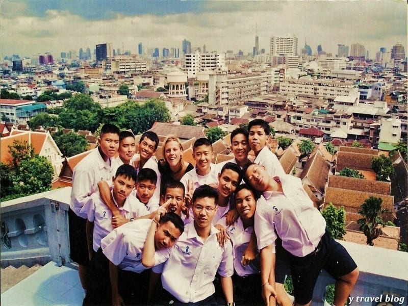 woman with thai students with bangkok skyline behind