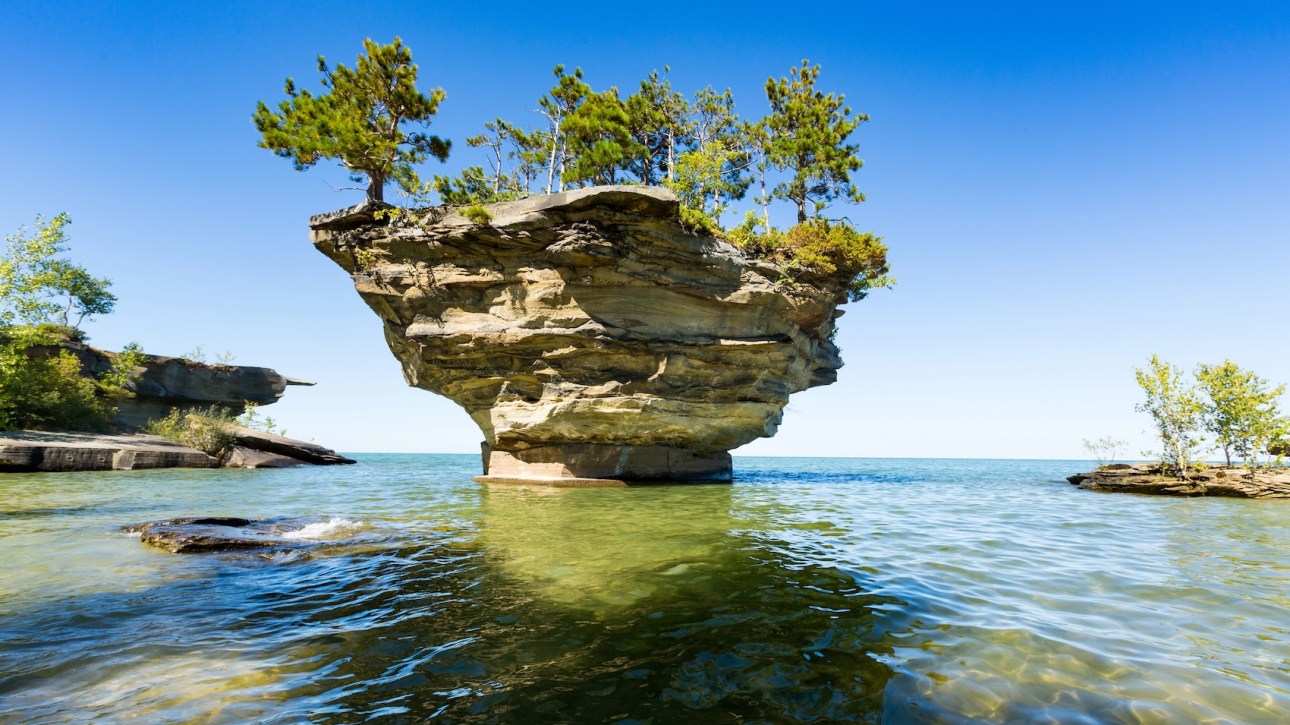 Turnip Rock on Lake Huron in Port Austin Michigan. An underwater view shows rocks under the clear surface of the water