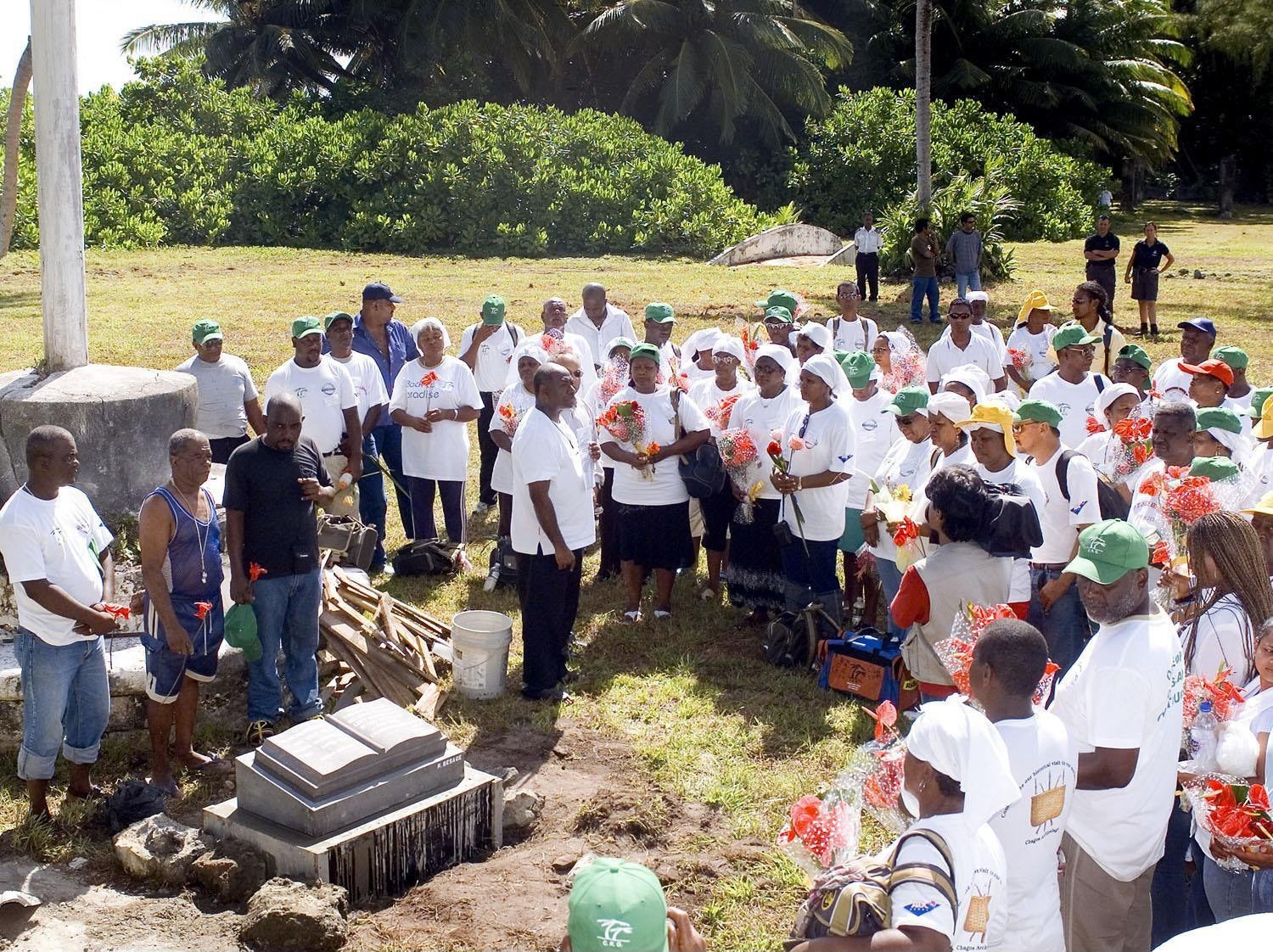 A group of Chagossians dedicating a memorial stone to mark their visit to Diego Garcia, part of the Chagos archipelago