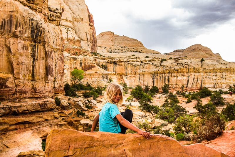 A person sitting on a rock