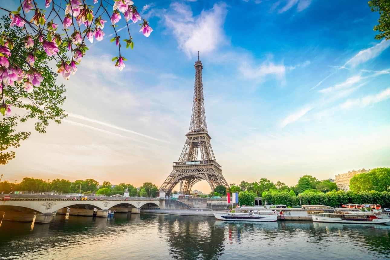 Paris Eiffel Tower and river Seine with sunrise in Paris, France. Eiffel Tower is one of the most iconic landmarks of Paris