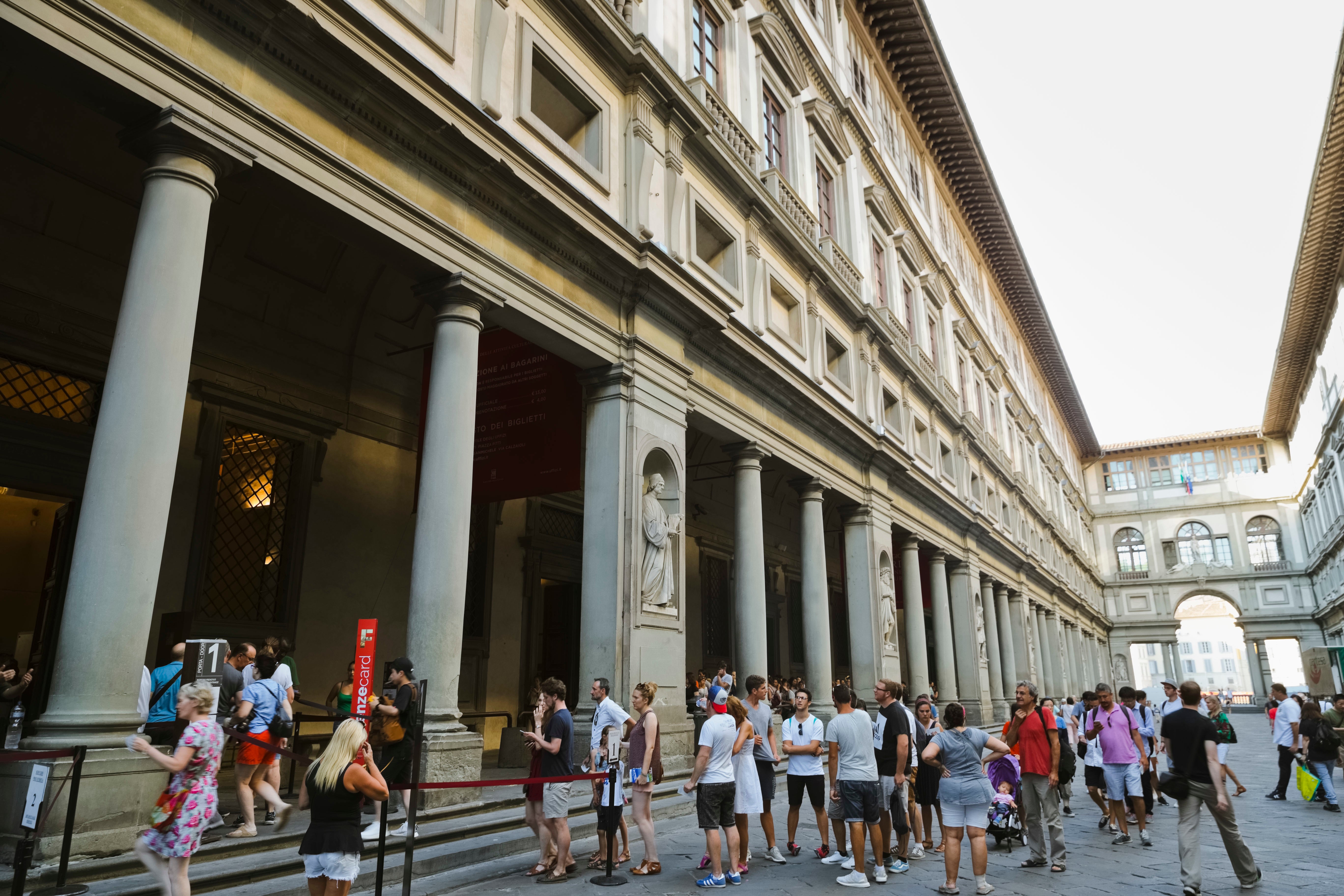 People line up to enter in the Uffizi Gallery in Florence, Italy