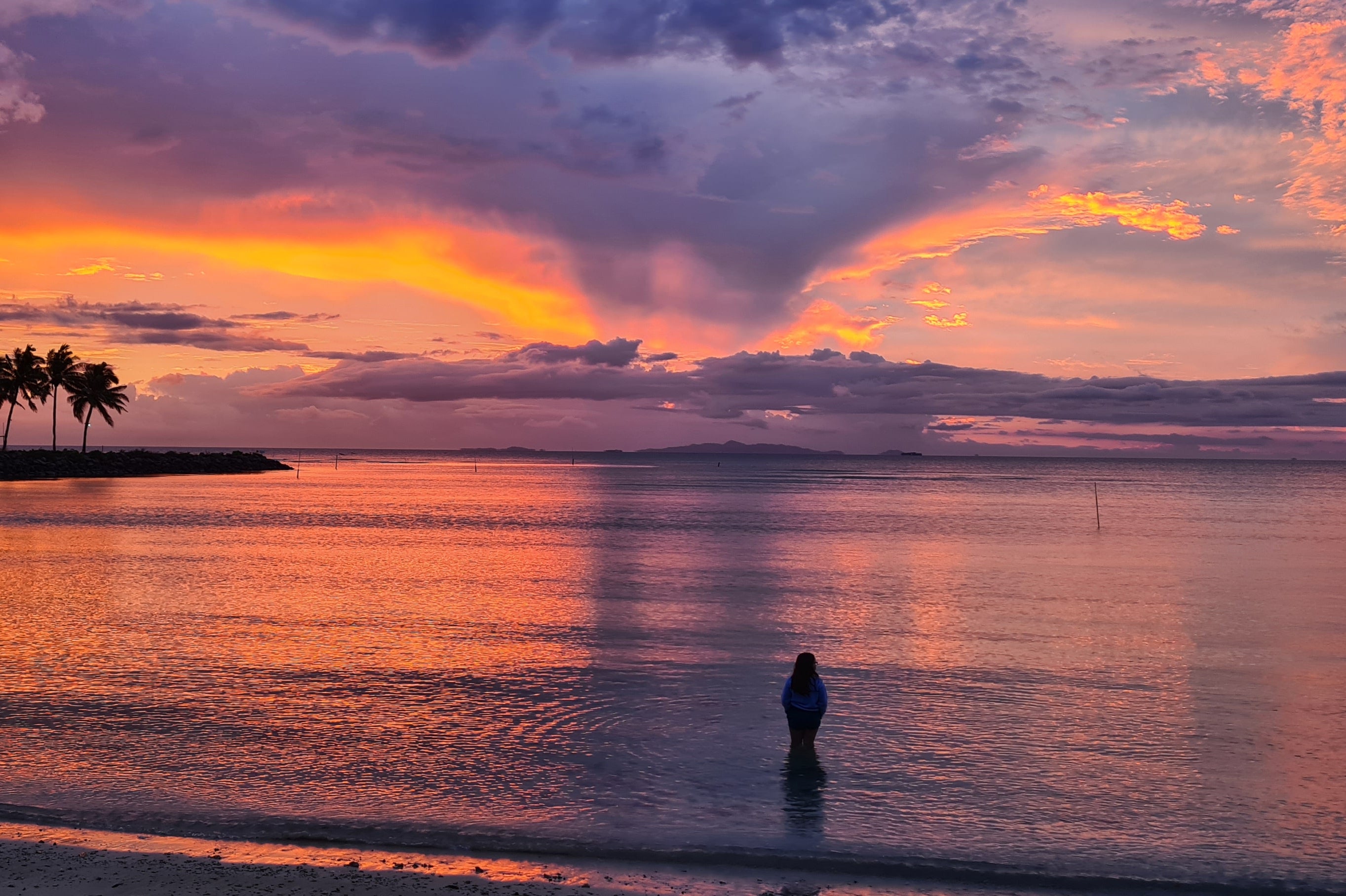 Clio’s daughter standing in the shallows of First Landing Resort