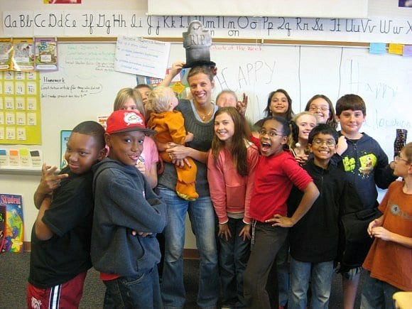 a woman smiling with kids