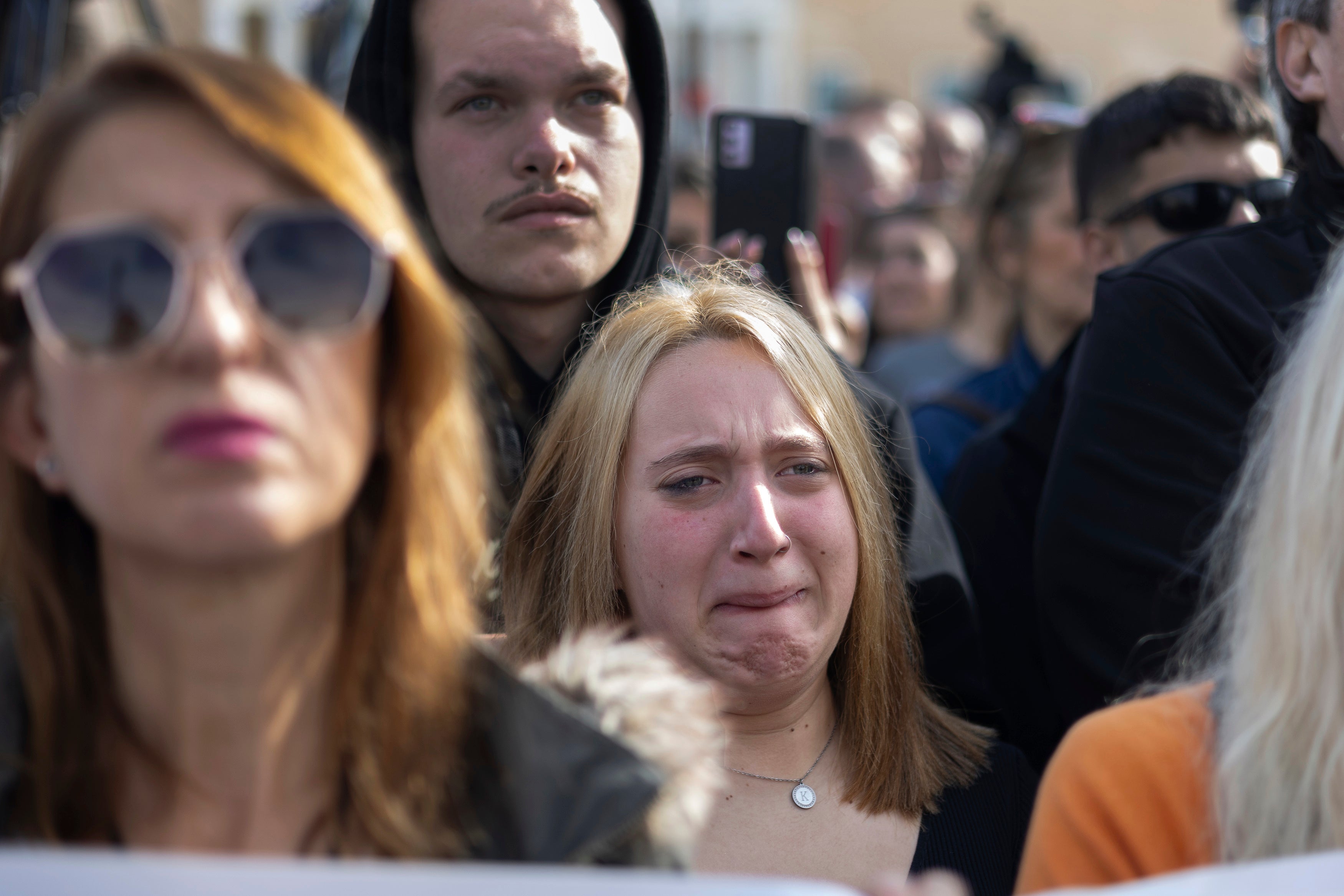 A woman reacts during a rally organised by the association of the families of victims of the Tempi train collision