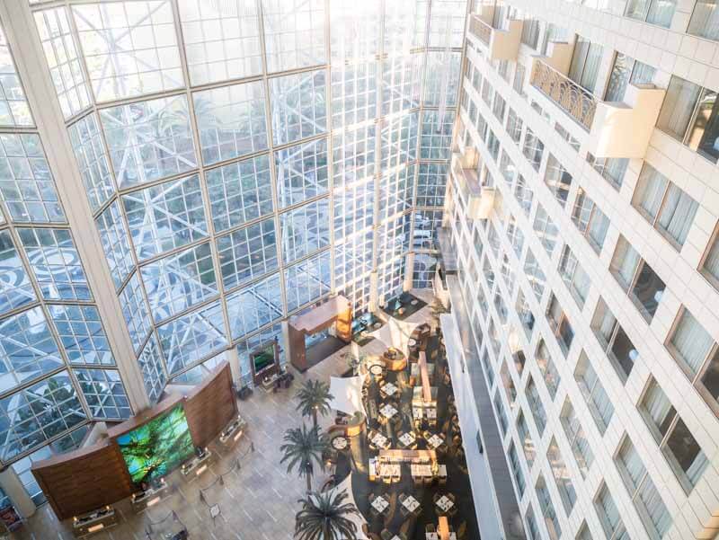 foyer with high glass windows and ceilings of Hyatt Regency )