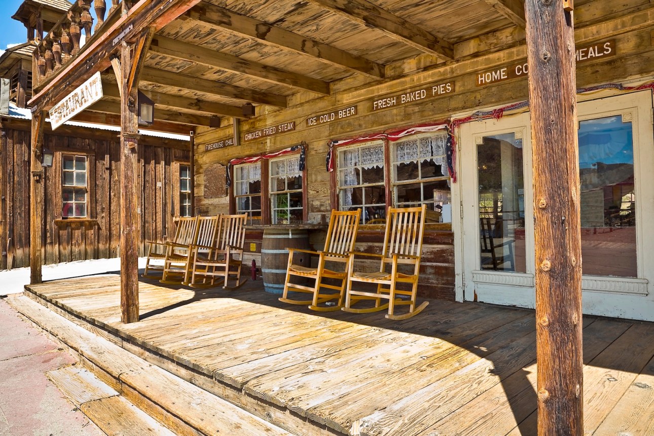 Traditional wooden chairs in a wooden patio Calico - ghost town and former mining town in San Bernardino County - California, United States - Wild west lifestyle