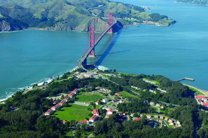 overview of golden gate bridge over water surrounded with mountains