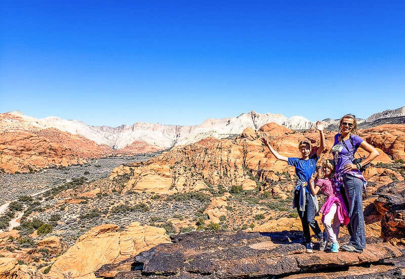 family posing in front of canyon views