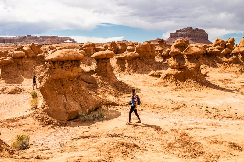 woman walking through a canyon