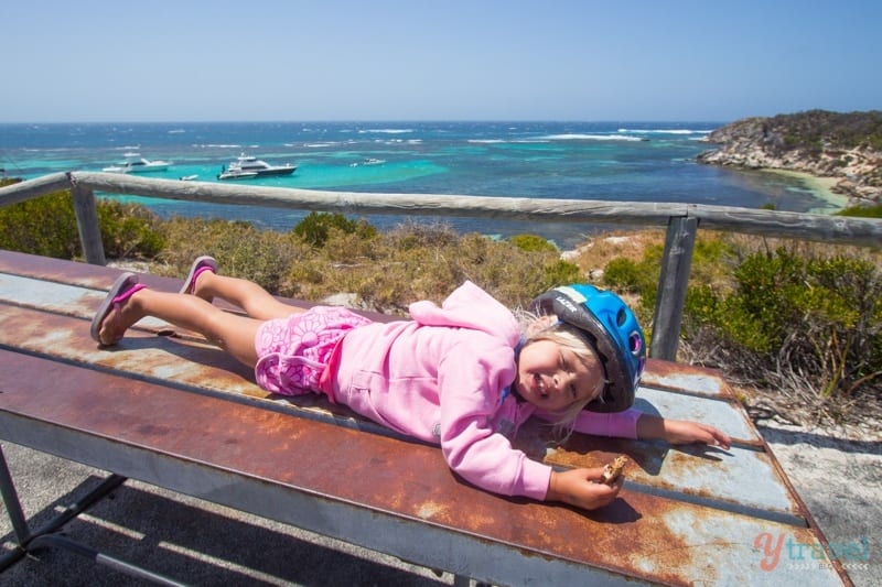 girl lying on a bench