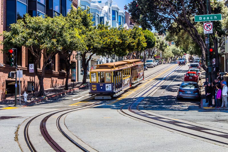 cable car going down hill in san francisco