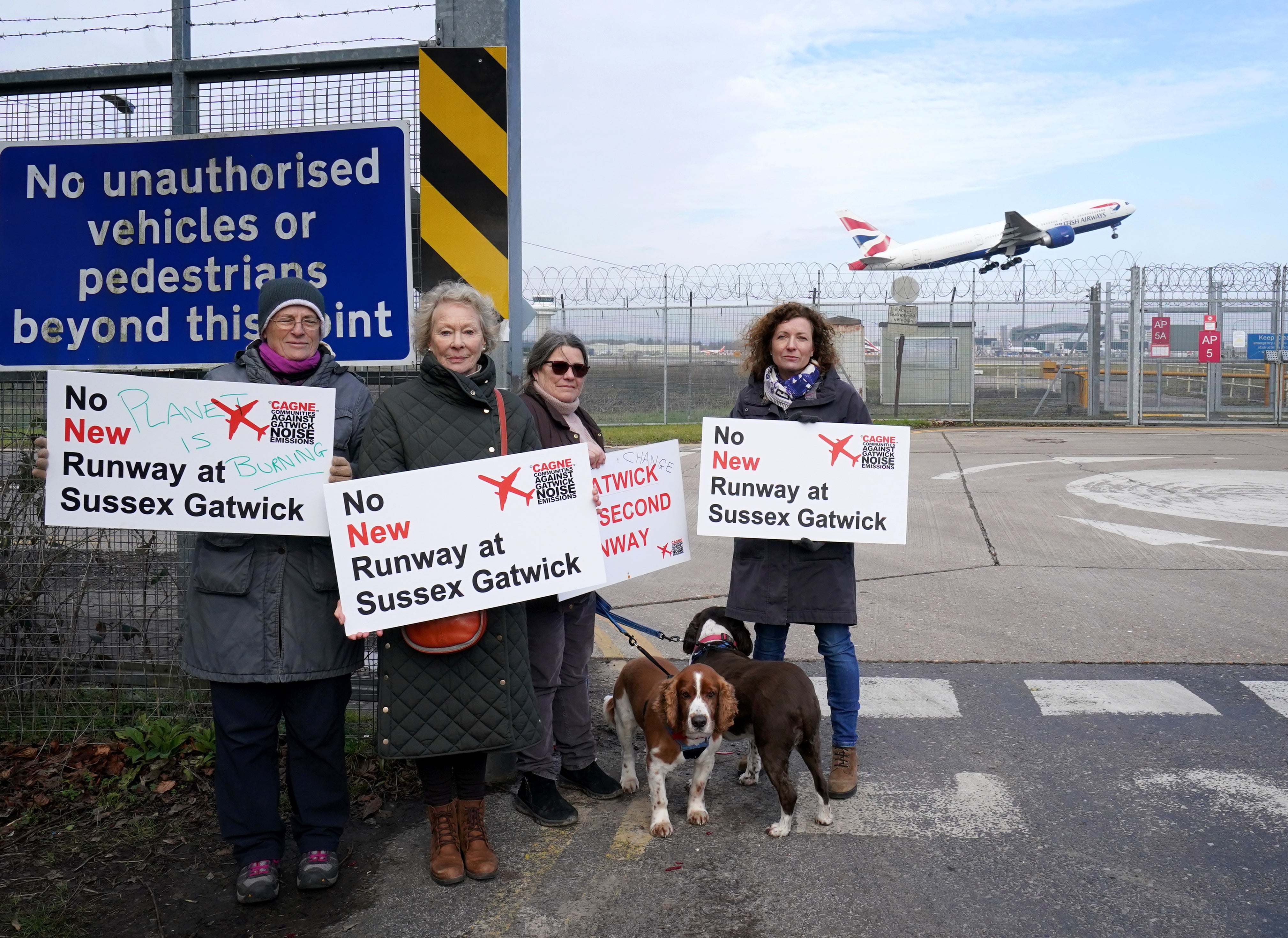 Campaigners next to the existing runway at Gatwick