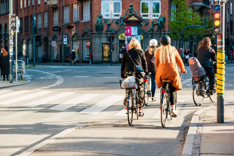 people riding bikes in denmark street