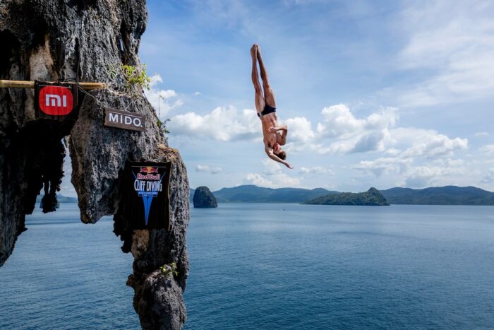 Andrea Barnaba of Italy dives from 27.5 metres off the cliff at Lagen Island during the first competition day of the first stop of the Red Bull Cliff Diving World Series in El Nido, Philippines on April 11, 2025. // Dean Treml / Red Bull Content Pool