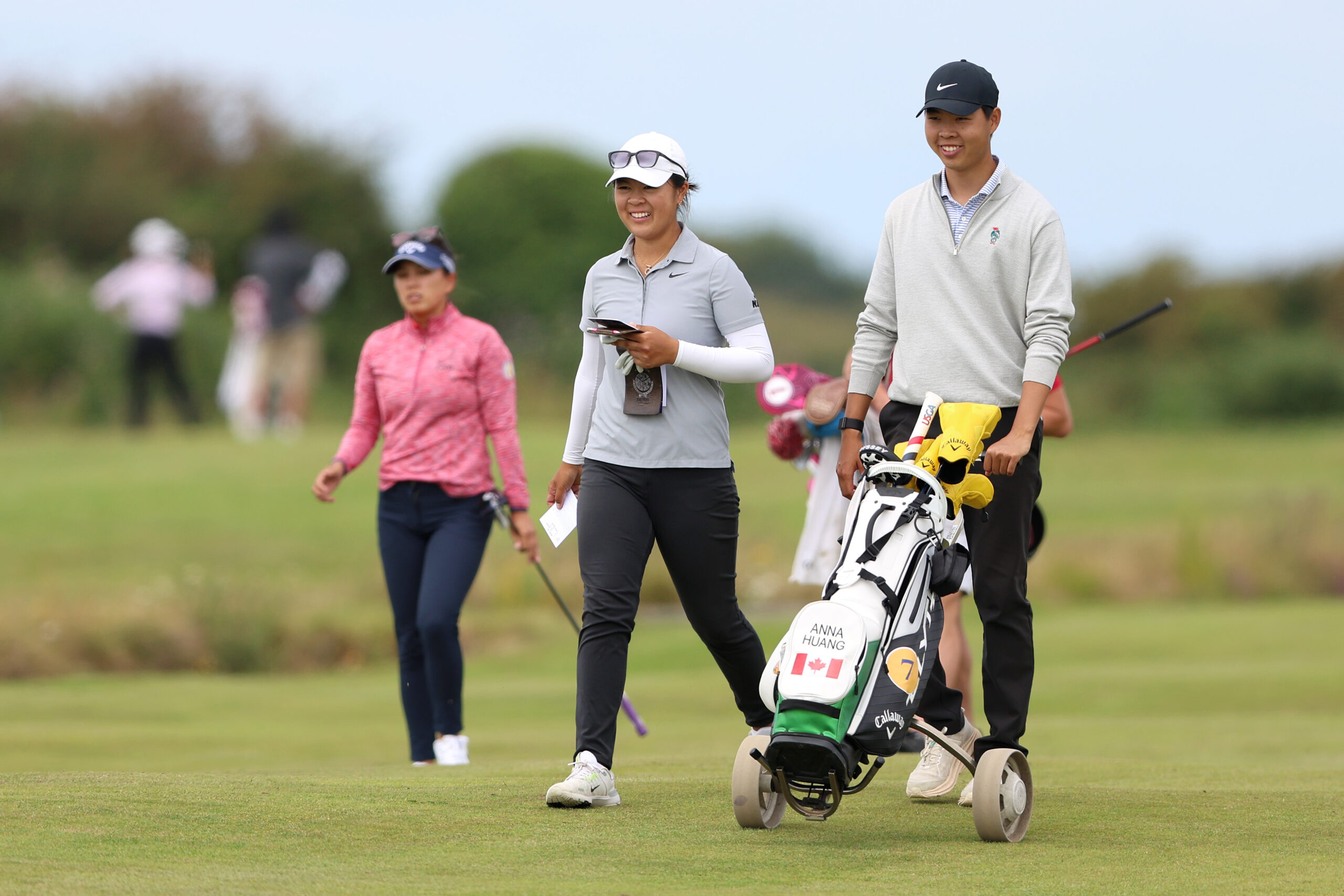 Anna Huang and her caddie pictured during Final Qualifying for the 2025 AIG Women's Open at Pyle and Kenfig Golf Club