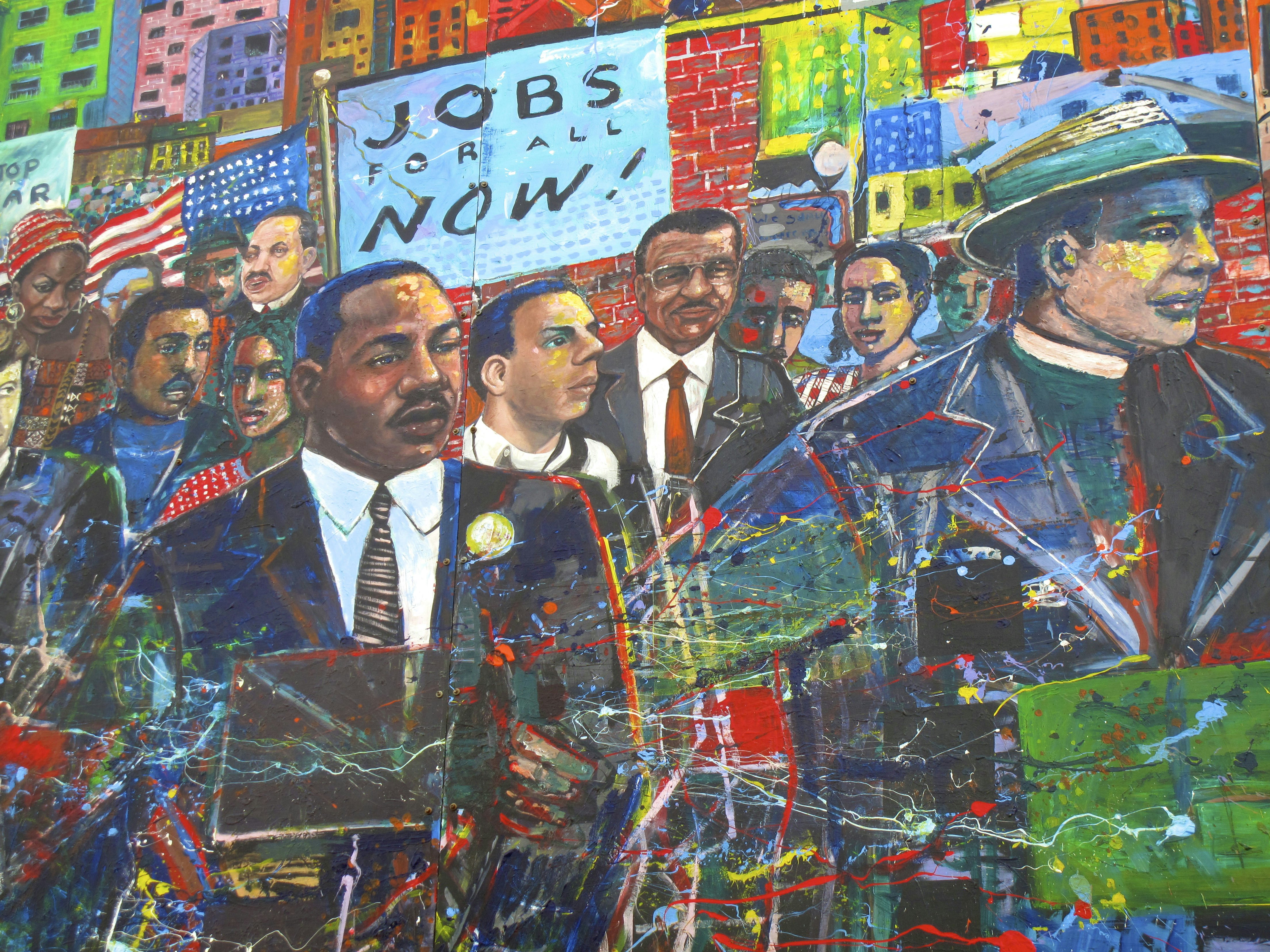 A painted mural depicts Martin Luther King Jr and other figures.