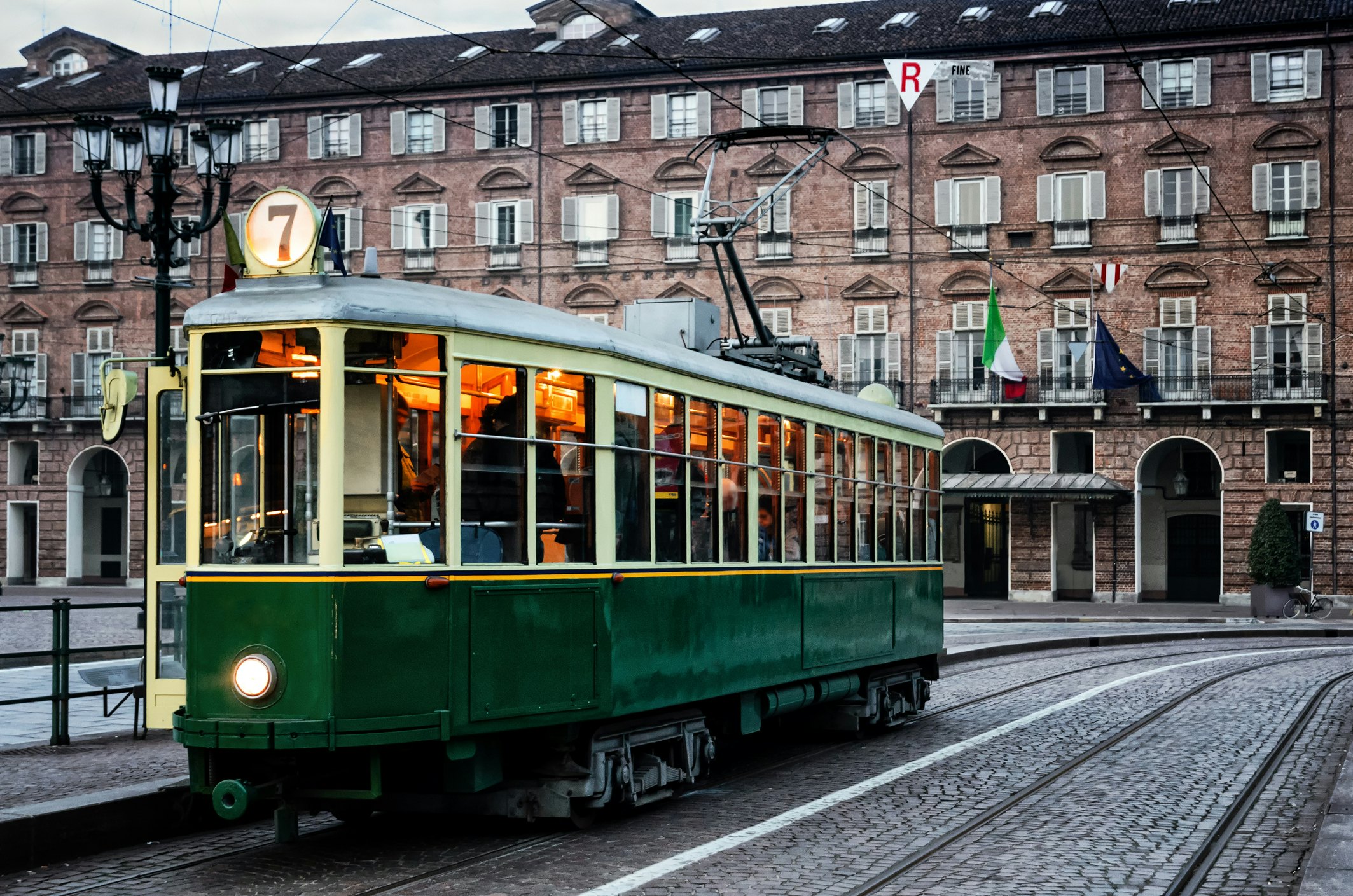 Turin's historic tram outside a brick building