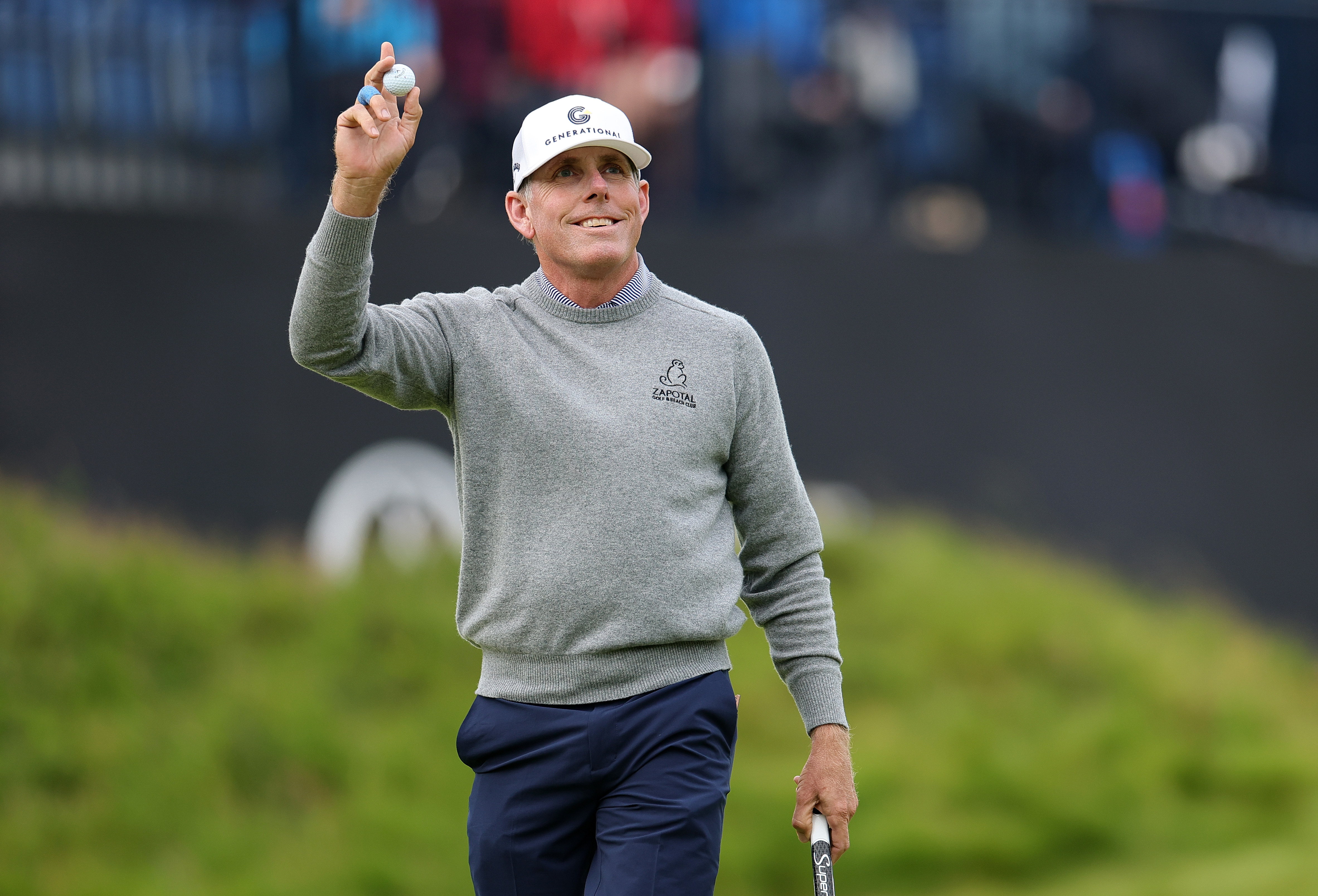 Justin Leonard waves to the crowd on the 18th hole at The Open Championship