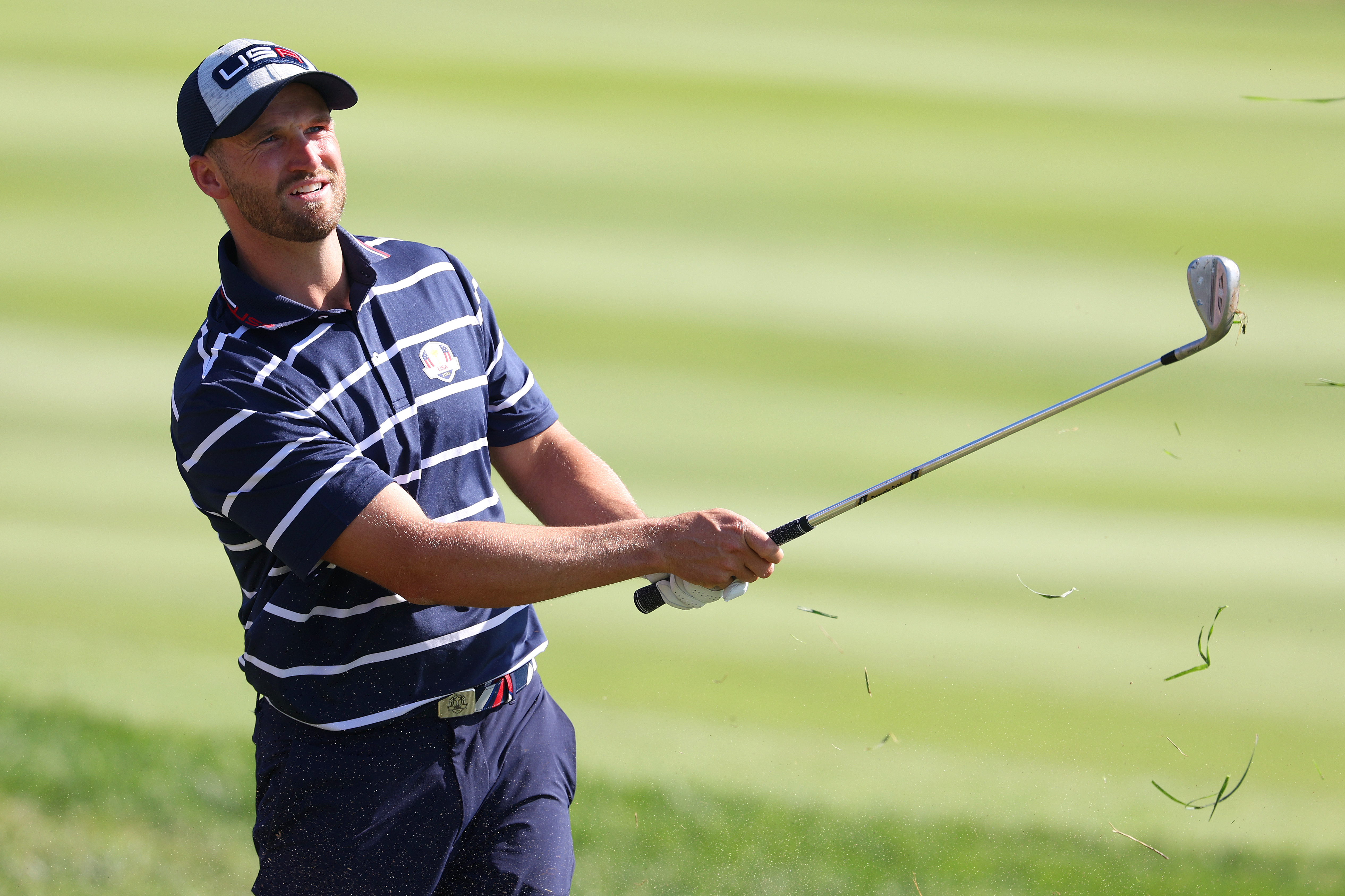 Wyndham Clark hits an iron shot