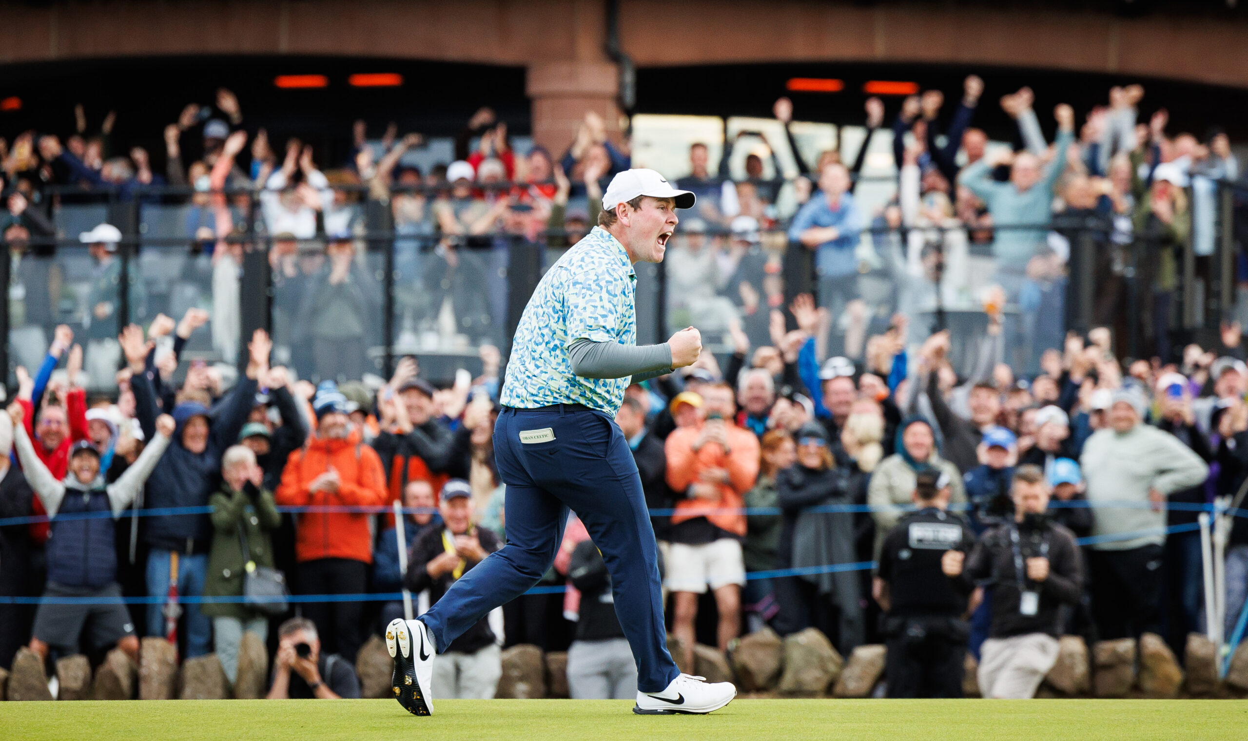 Robert MacIntyre celebrates his Genesis Scottish Open victory on the 18th green