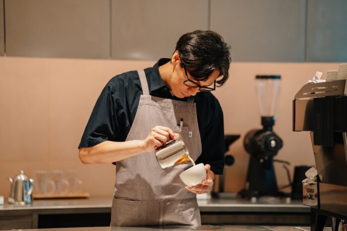 A Blue Bottle Coffee barista prepares each cup with precisionat the brand’s first Southeast Asian location with both indoor and alfresco dining