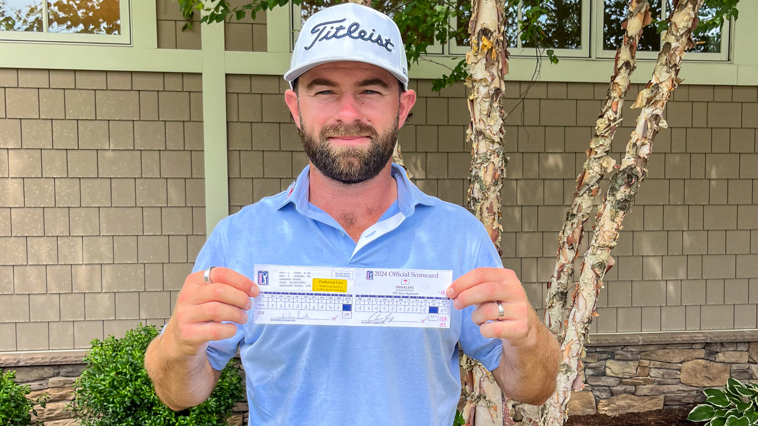 Cameron Young with his Travelers Championship card