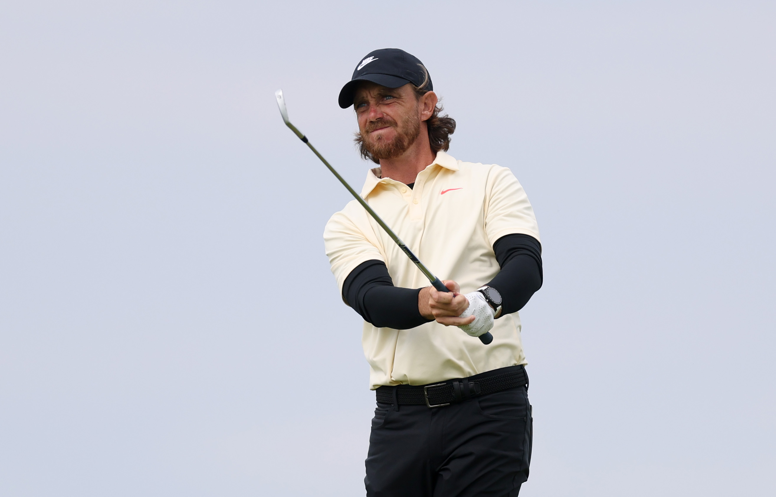 Tommy Fleetwood hits an iron shot