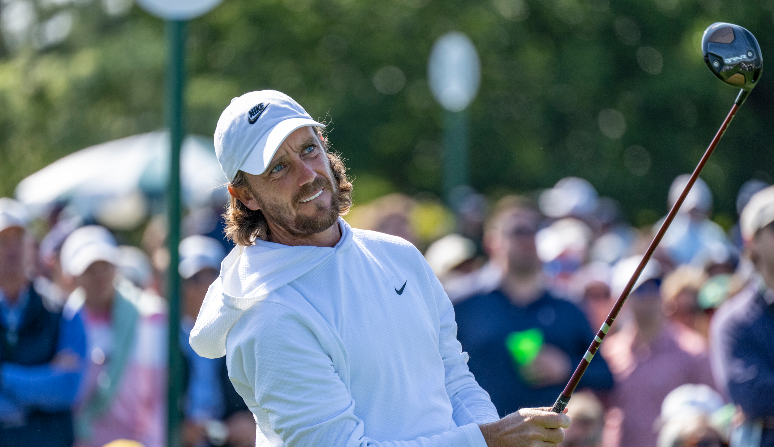 Tommy Fleetwood watches a tee shot at The Masters