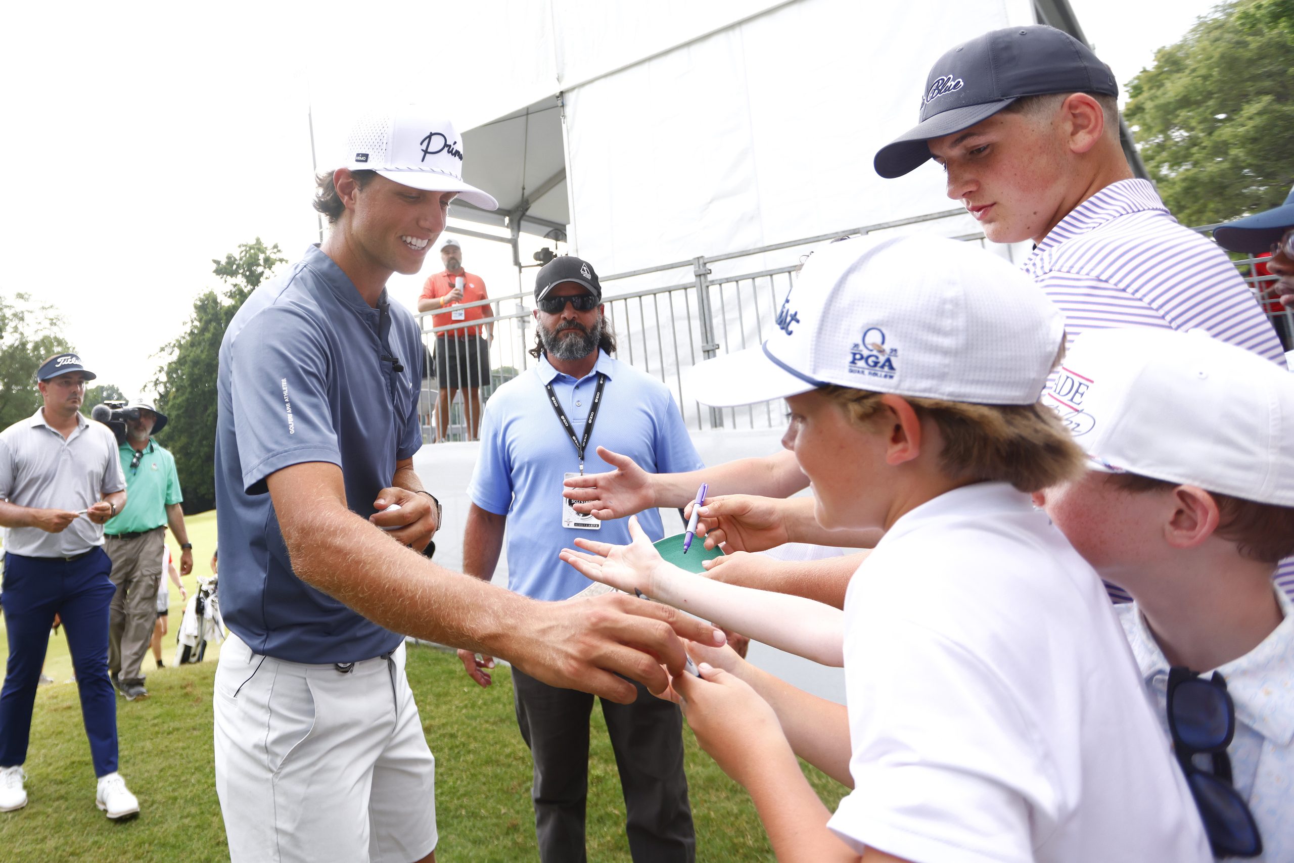 Grant Horvat shakes hands with young fans