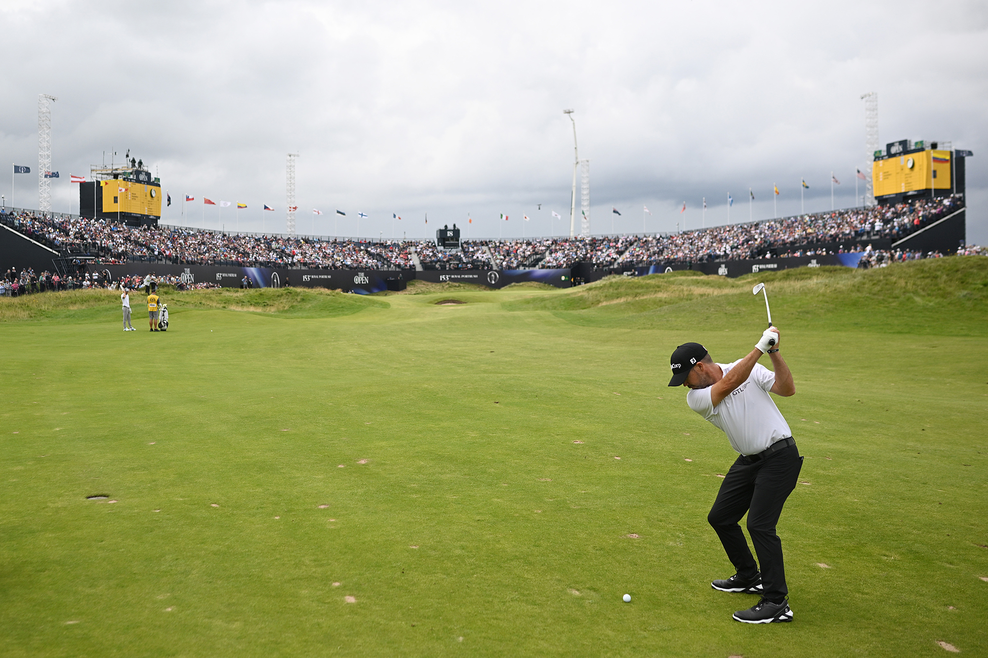 Brian Harman at the top of his backswing hitting a shot into the 18th green at Royal Portrush during the 153rd Open Championship
