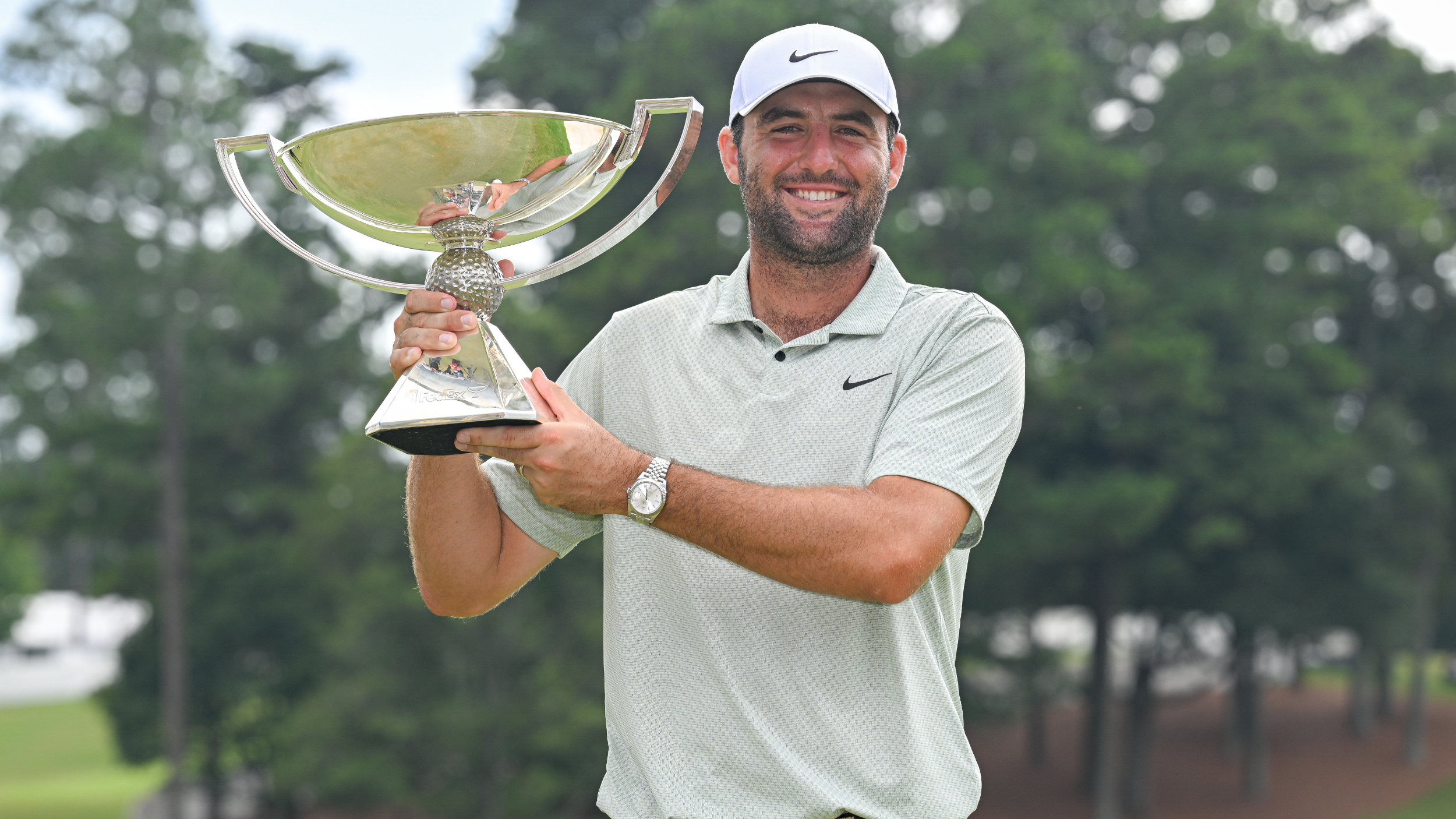 Scottie Scheffler with the FedEx Cup