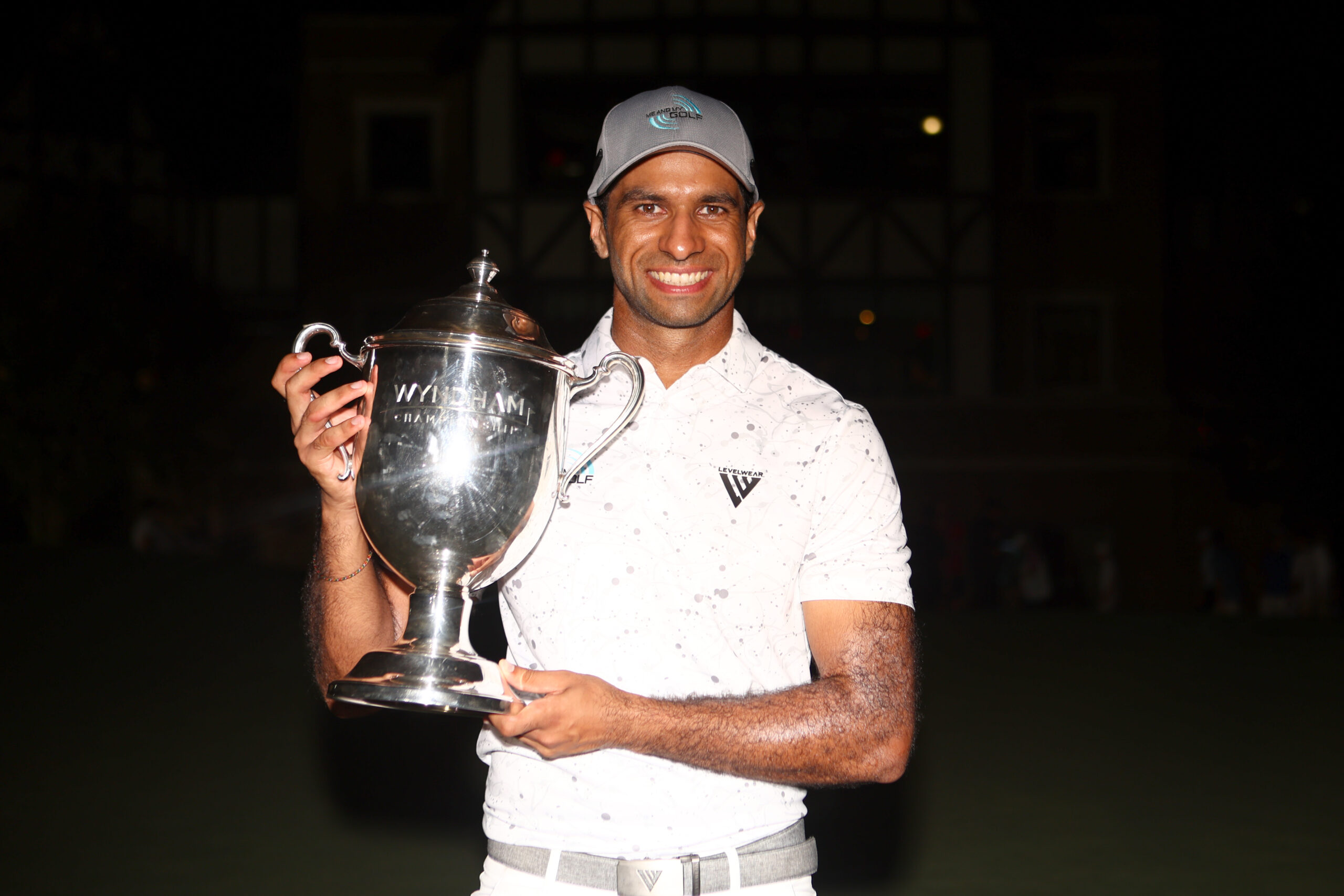 Aaron Rai holds the Wyndham Championship trophy