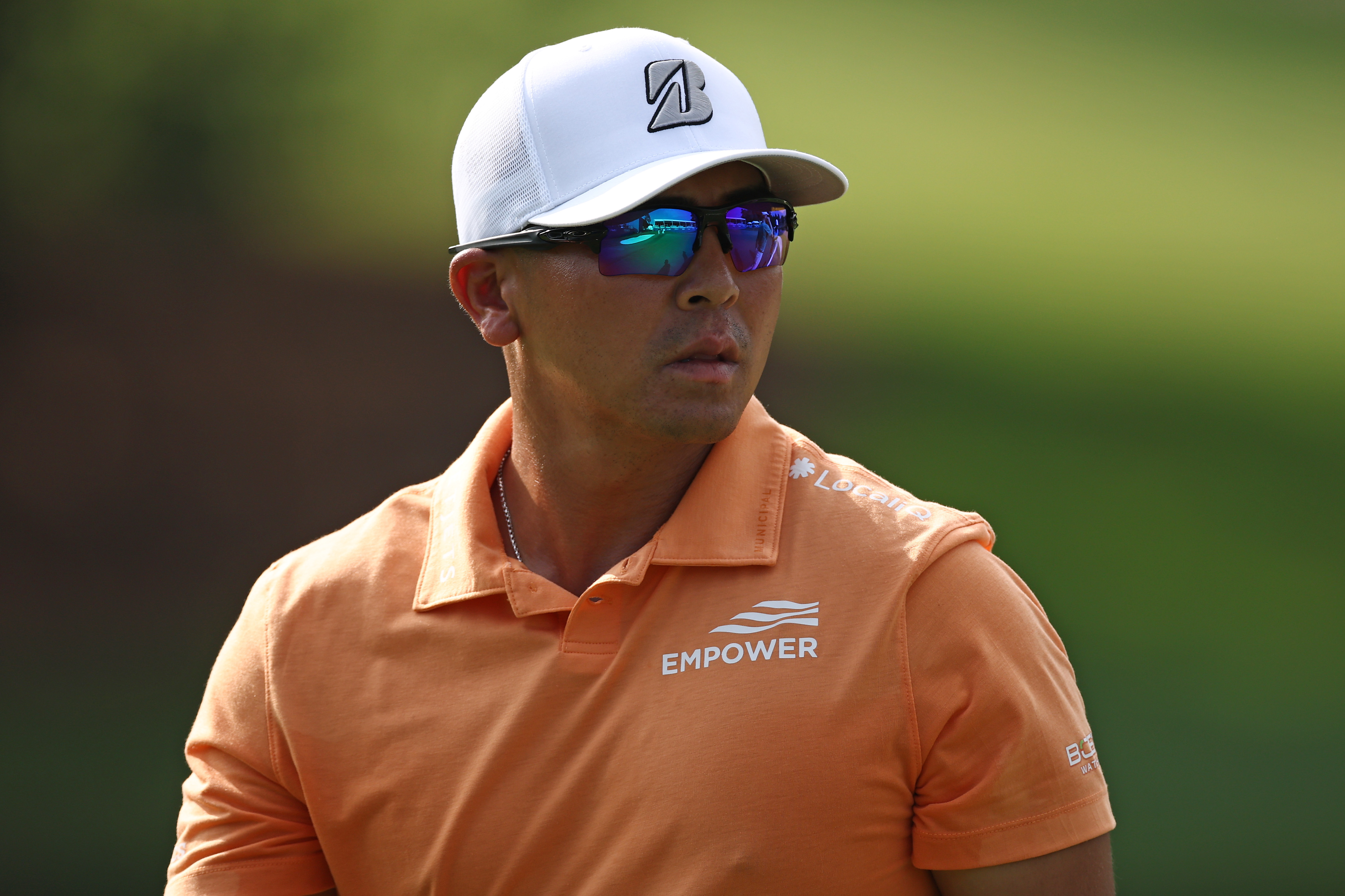 Kurt Kitayama walks off the green