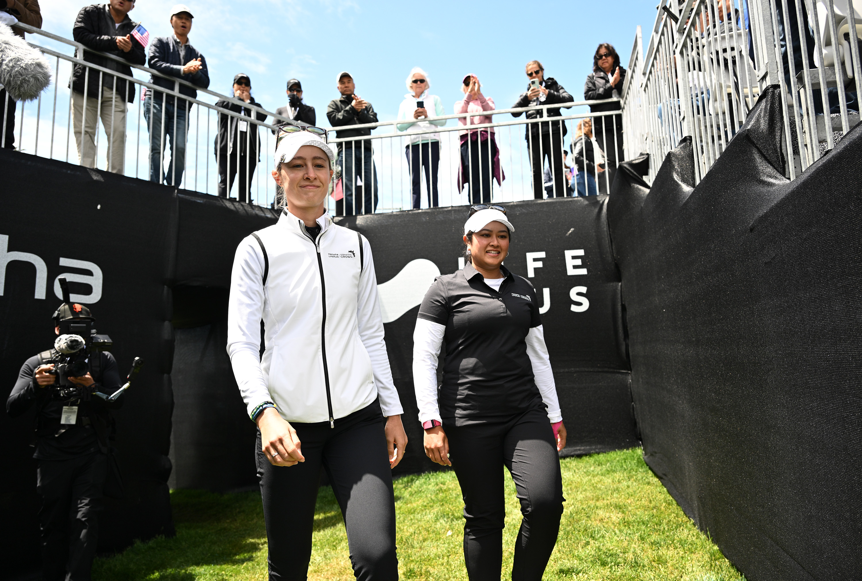 Nelly Korda and Lilia Vu walk to the 1st tee at the 2023 International Crown