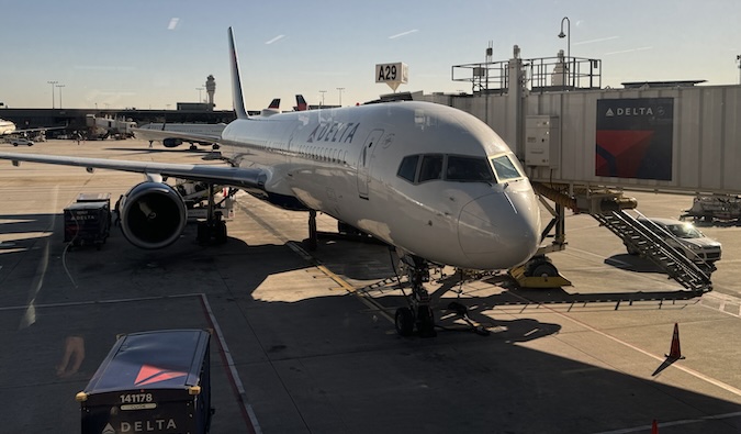picture of a delta airplane at the gate ready for take off