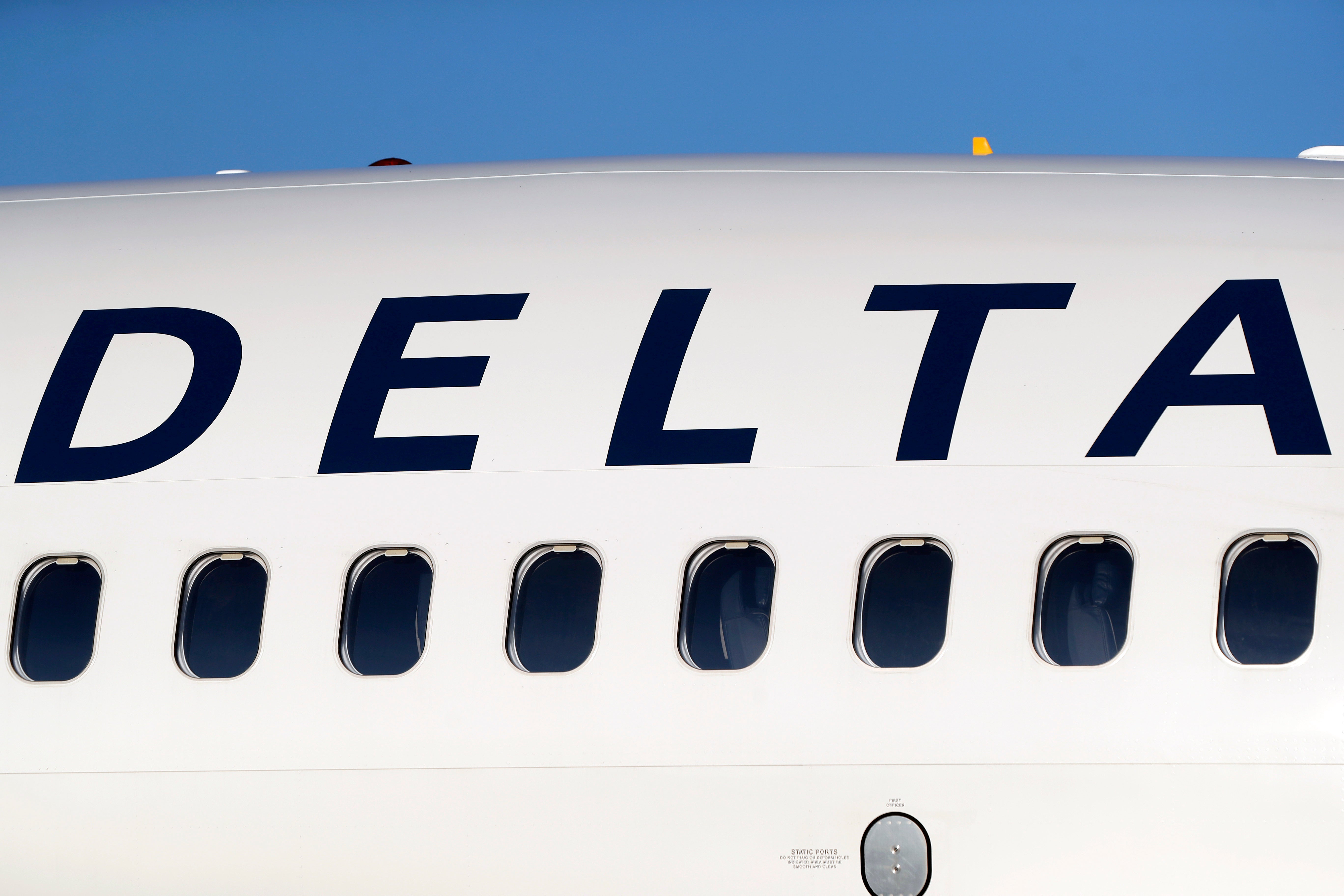 Delta and United airlines are being sued by passengers who paid extra for window seats, but were instead seated next to an empty wall.
