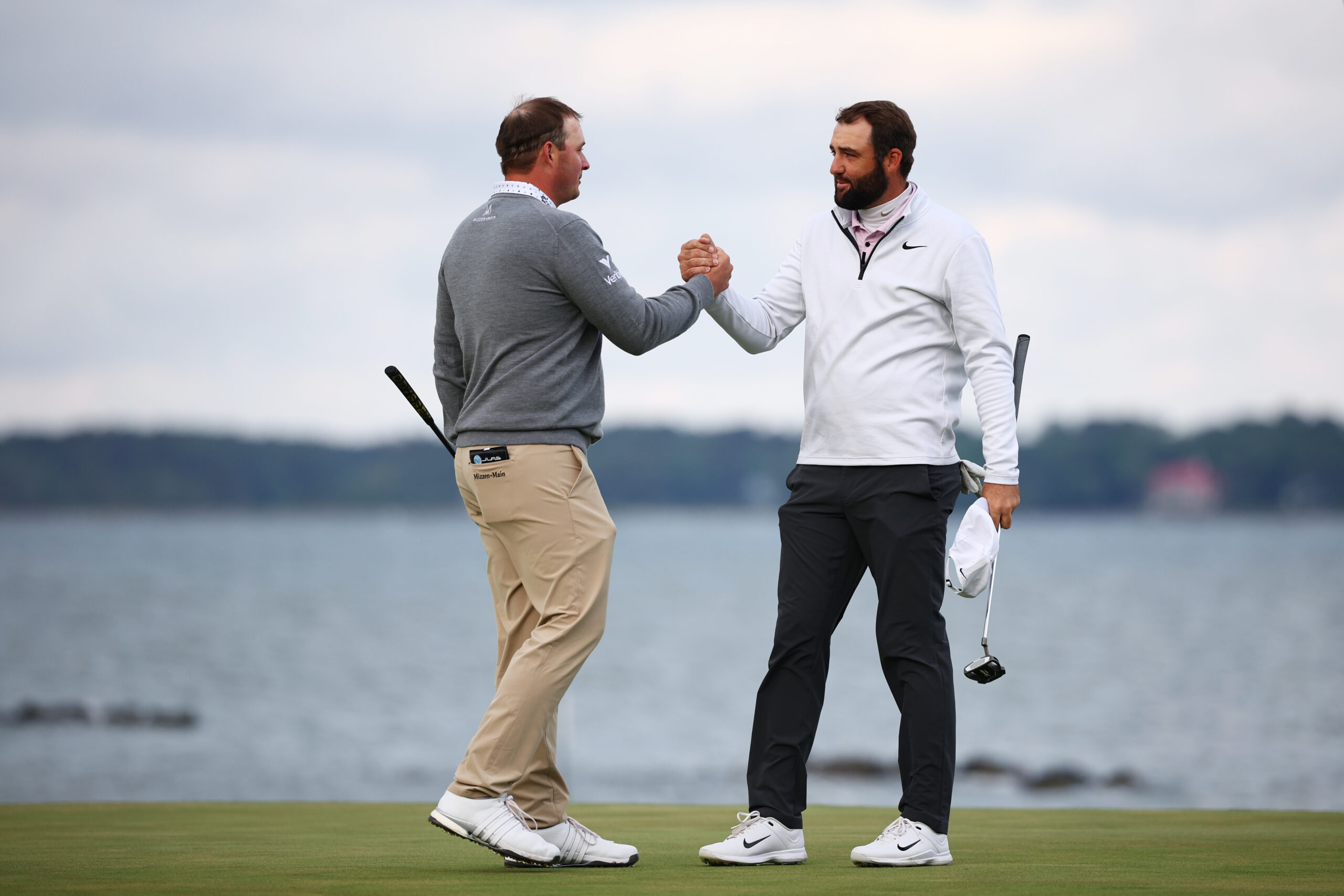 Sepp Straka and Scottie Scheffler shake hands