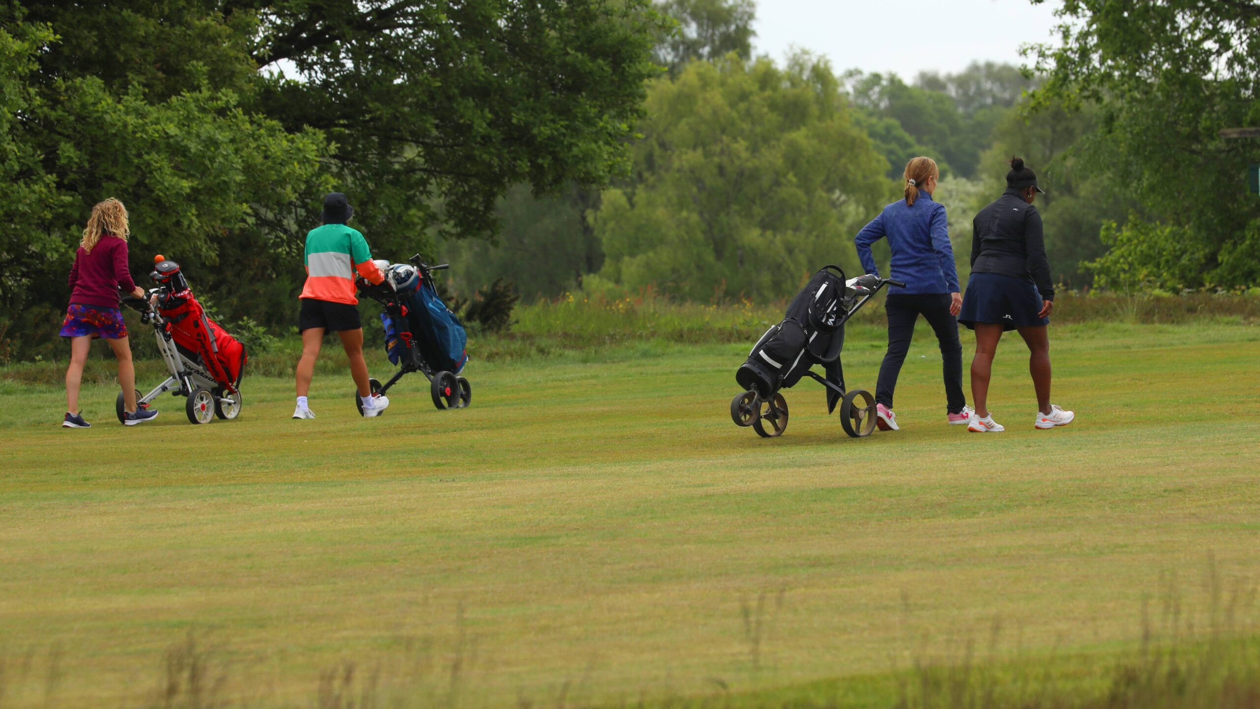 Women golfers on fairway