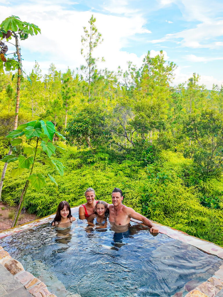 family sitting in private plunge pool hidden valley villa